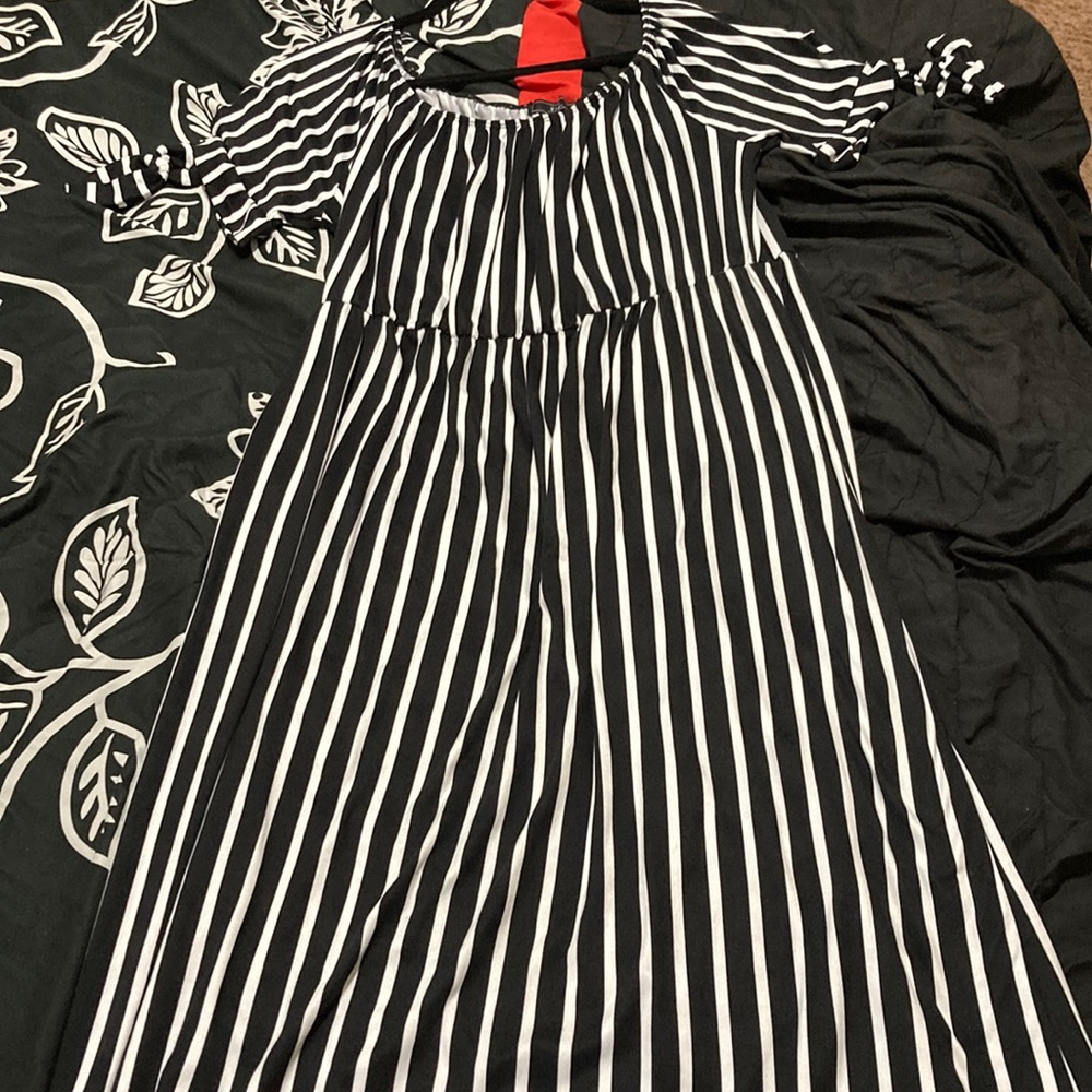 This is a long, a little off the shoulder black and white dress.